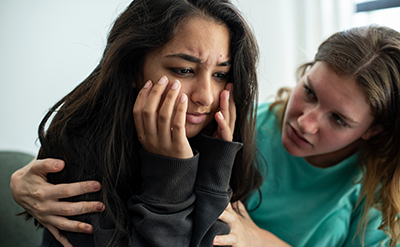 anxiety-in-children-v1 Girl consoling her sad friend.